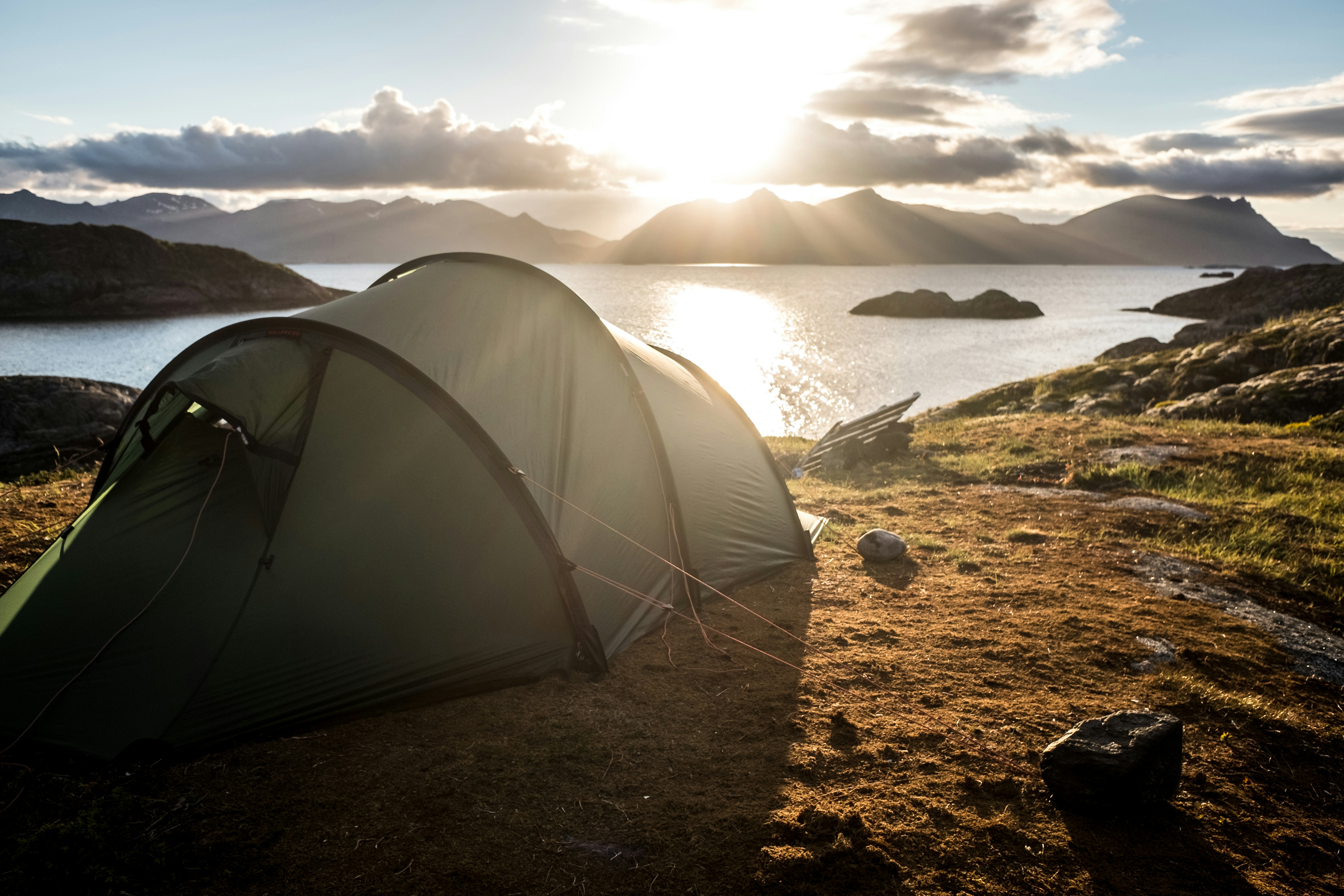 Group of tents set up in a field for camping